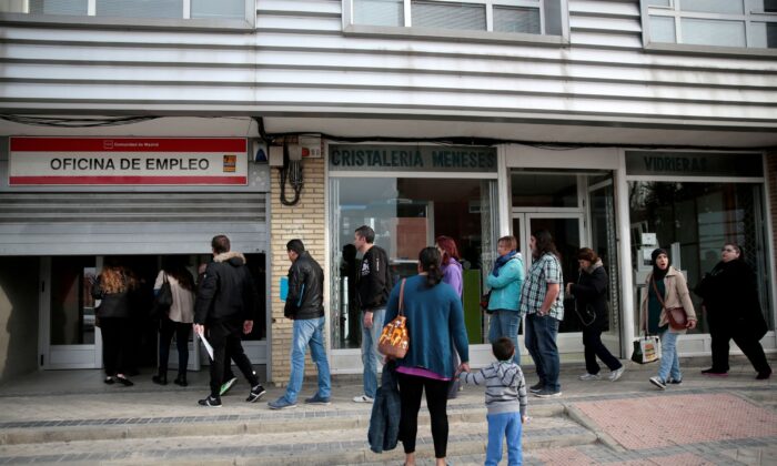 On April 27, 2016, people will enter a government-run job center in Madrid, Spain.  (Andrea Comas / Reuters)