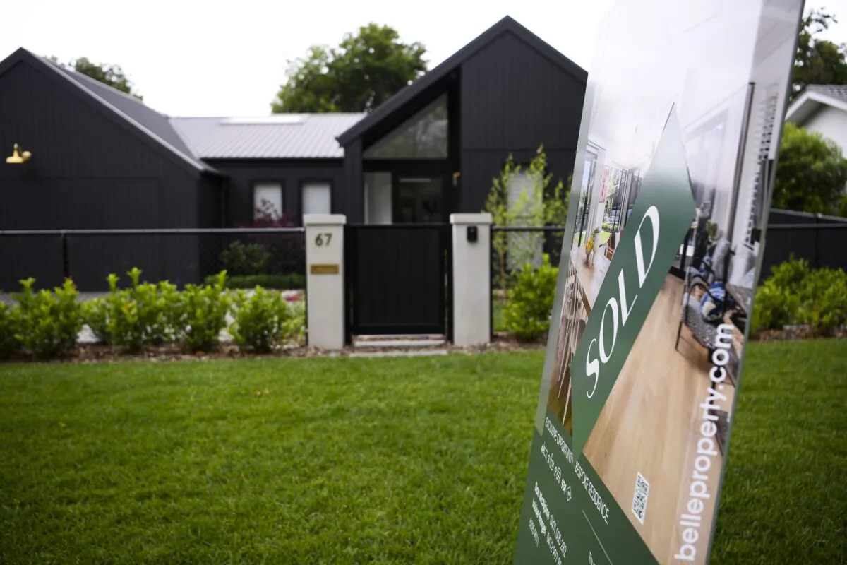 A ‘SOLD’ sign is seen outside a house in Canberra, Australia, on Dec. 8, 2021. (AAP Image/Lukas Coch) NO ARCHIVING