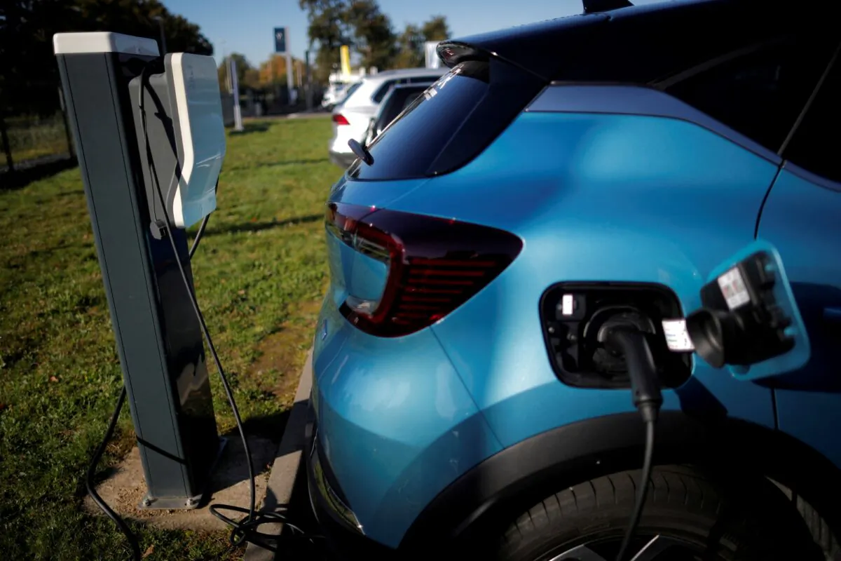 This photo shows a Renault wallbox is used by a Renault Captur hybrid car at a dealership in Les Sorinieres, near Nantes, France, taken on Oct. 23, 2020. (Stephane Mahe/Reuters)