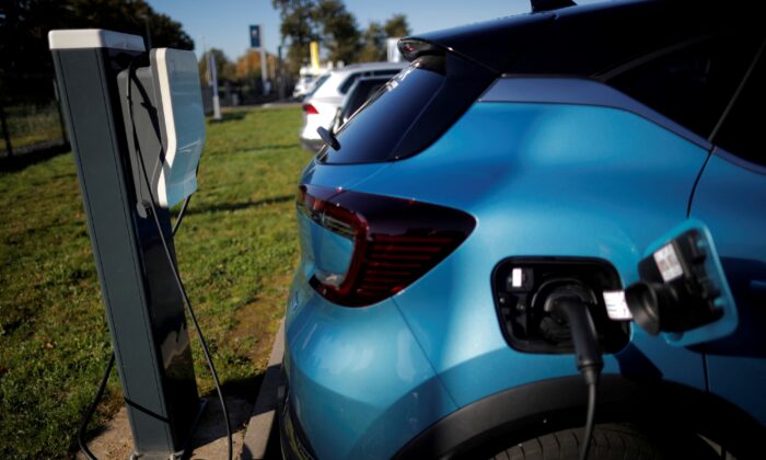 This photo shows a Renault wallbox is used by a Renault Captur hybrid car at a dealership in Les Sorinieres, near Nantes, France, taken on Oct. 23, 2020. (Stephane Mahe/Reuters)