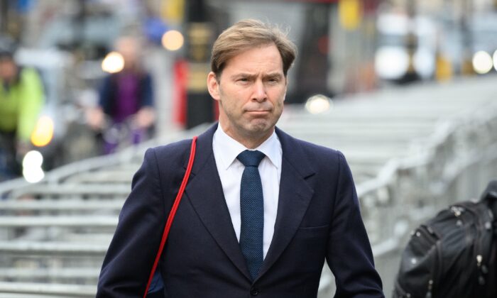 Tobias Ellwood, MP for Bournemouth East, walks through Westminster, in London, on Feb. 2, 2022. (Leon Neal/Getty Images)