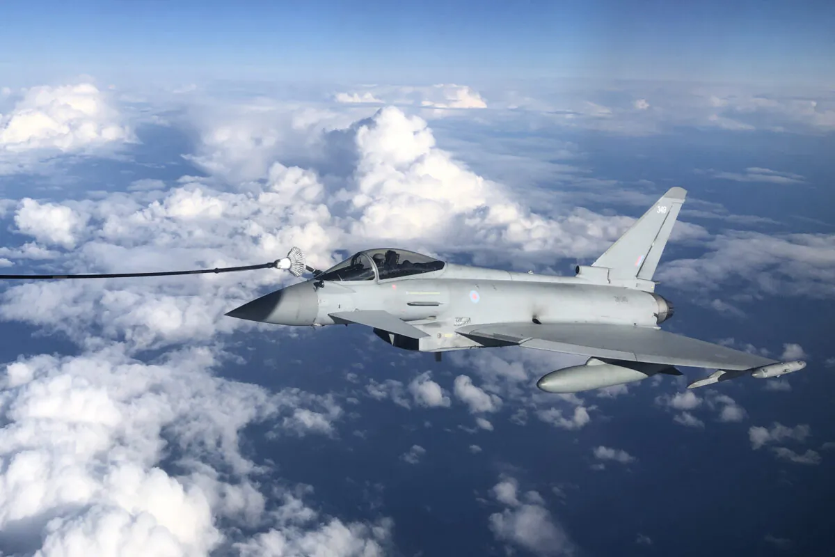 An RAF Typhoon combat aircraft refuels from an RAF Voyager aircraft in flight over the North Sea, on Oct. 8, 2020. (Leon Neal/Getty Images)