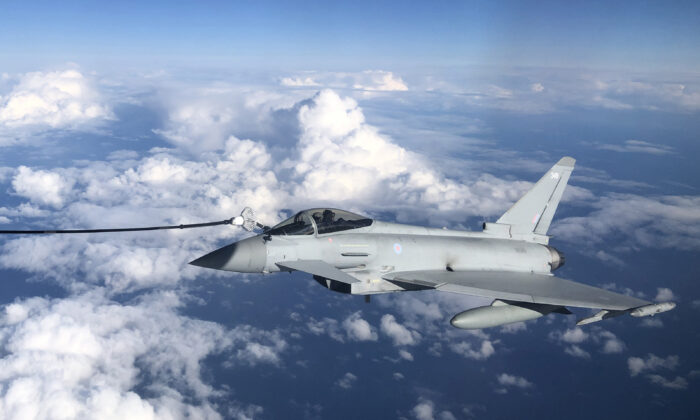 An RAF Typhoon combat aircraft refuels from an RAF Voyager aircraft in flight over the North Sea, on Oct. 8, 2020. (Leon Neal/Getty Images)
