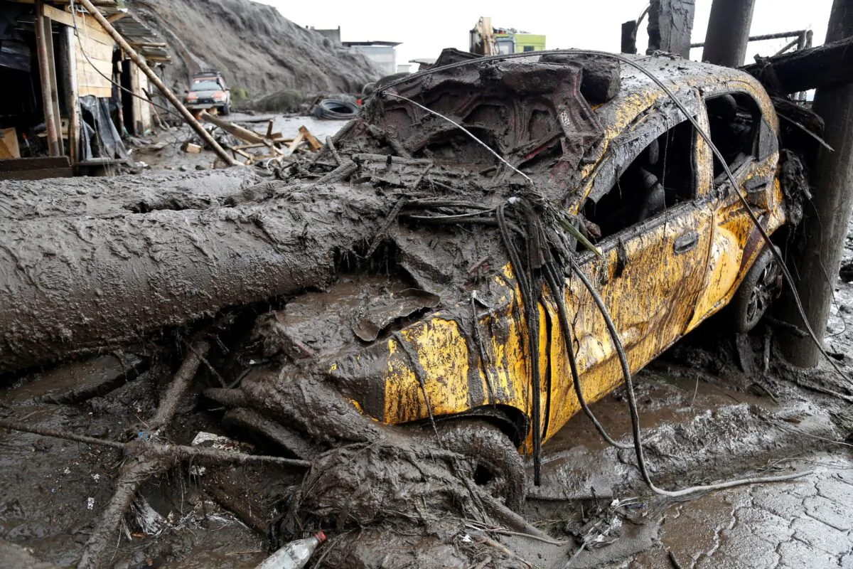 A car is seen in an area of a landslide ​in Quito, Ecuador, on Feb. 1, 2022. (Jonatan Rosas/Reuters)
