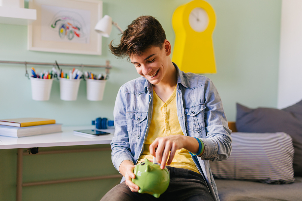 Whether kids go to college or enter the workforce sooner, they all need to learn how to manage their money wisely. (Dejan Dundjerski/Shutterstock)
