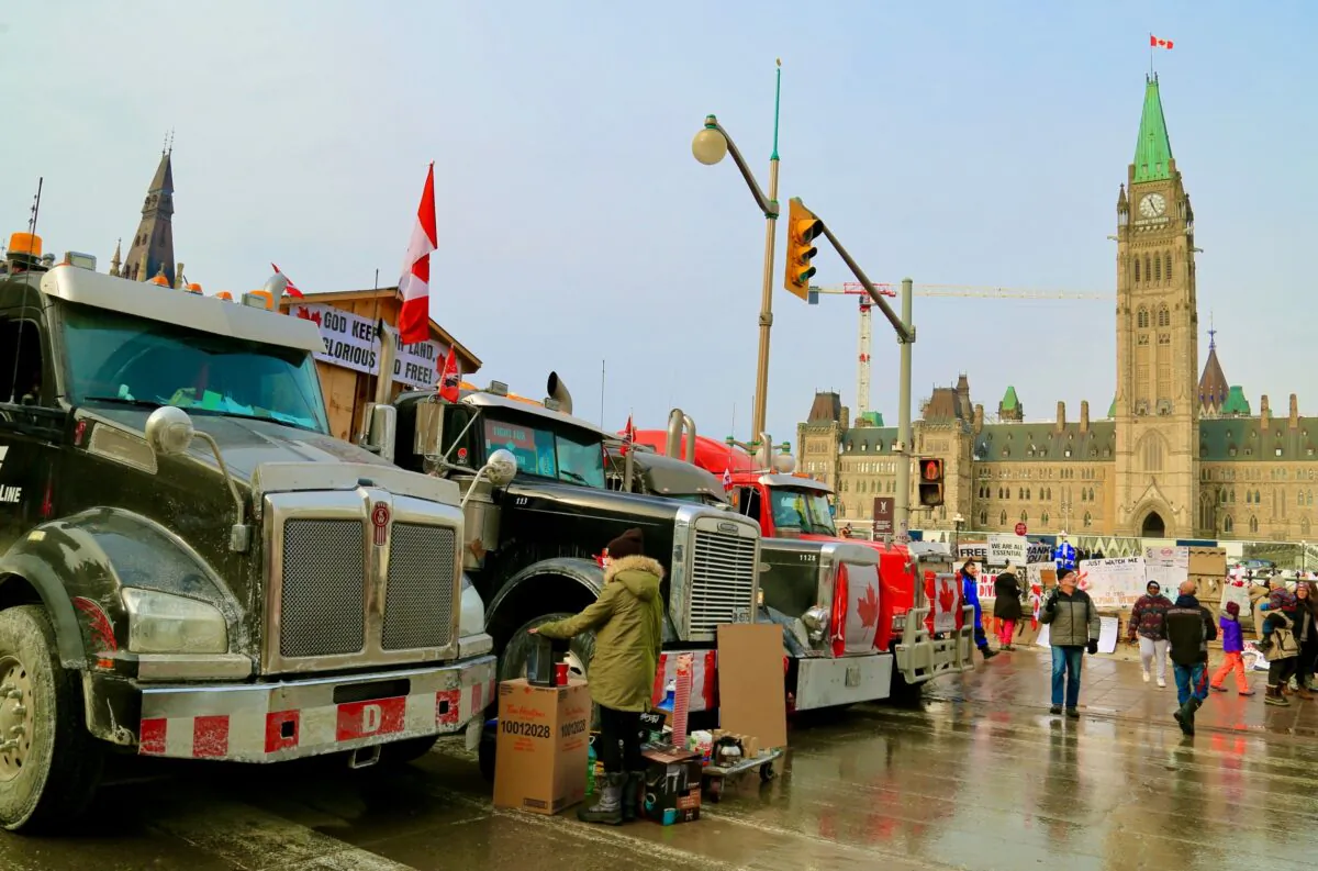 Trucks are parked near Parliament Hill in Ottawa as demonstrators continue to protest COVID-19 mandates and restrictions on Feb. 2, 2022. (Jonathan Ren/The Epoch Times)