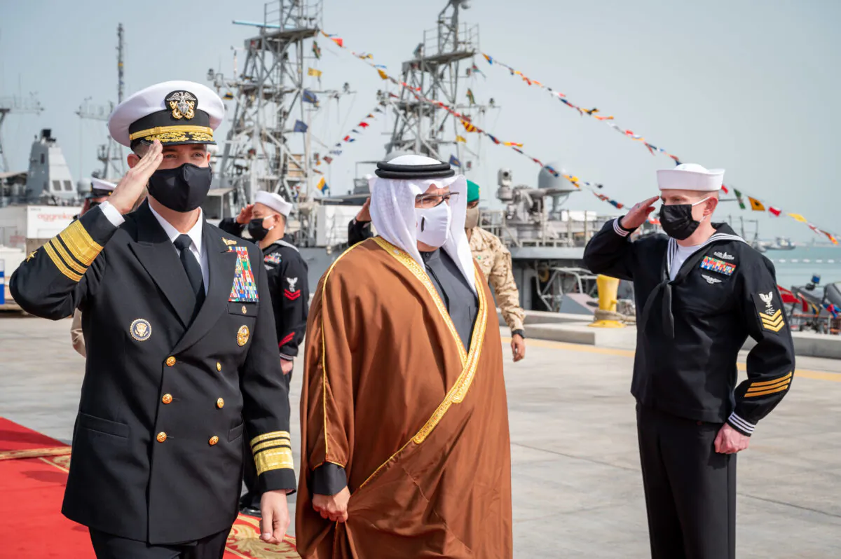 His Royal Highness Prince Salman bin Hamad Al-Khalifa, Crown Prince, Deputy Supreme Commander and Prime Minister of Bahrain, center, receives a brief on the GHOST 4 unmanned aerial vehicle at Naval Support Activity Bahrain on Jan. 31, 2022. (U.S. Navy photo by Mass Communication Specialist 1st Class Mark Thomas Mahmod)