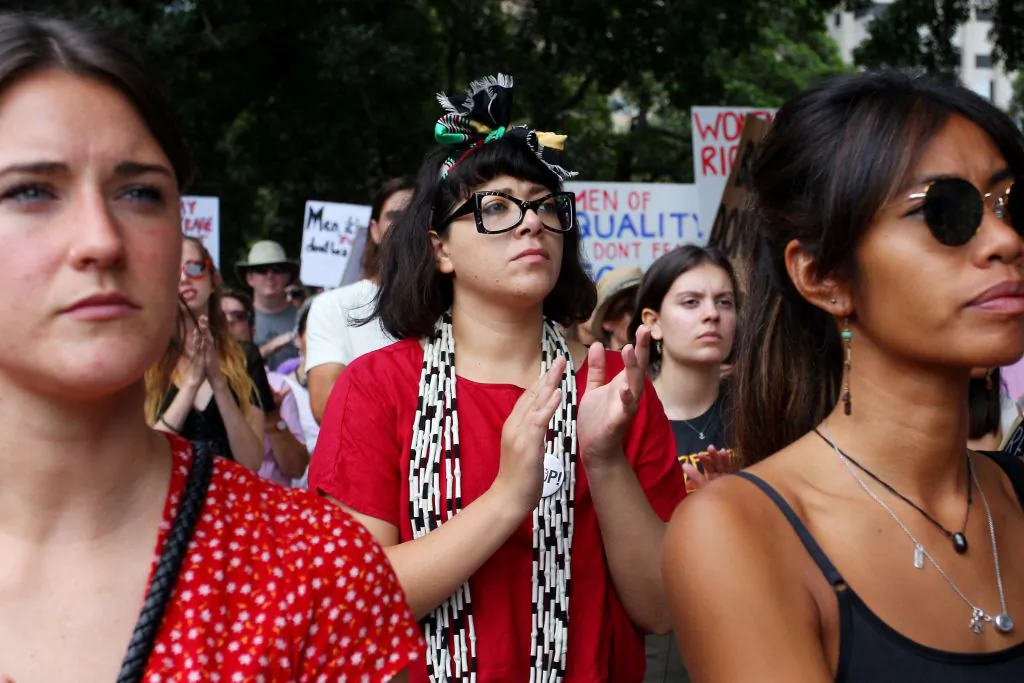 Protesters gather at Hyde Park during the 'Women's Wave' March in Sydney, Australia on January 20, 2019, to draw attention to issues of domestic violence against women in Australia and drive cultural change. (Photo by Lisa Maree Williams/Getty Images)