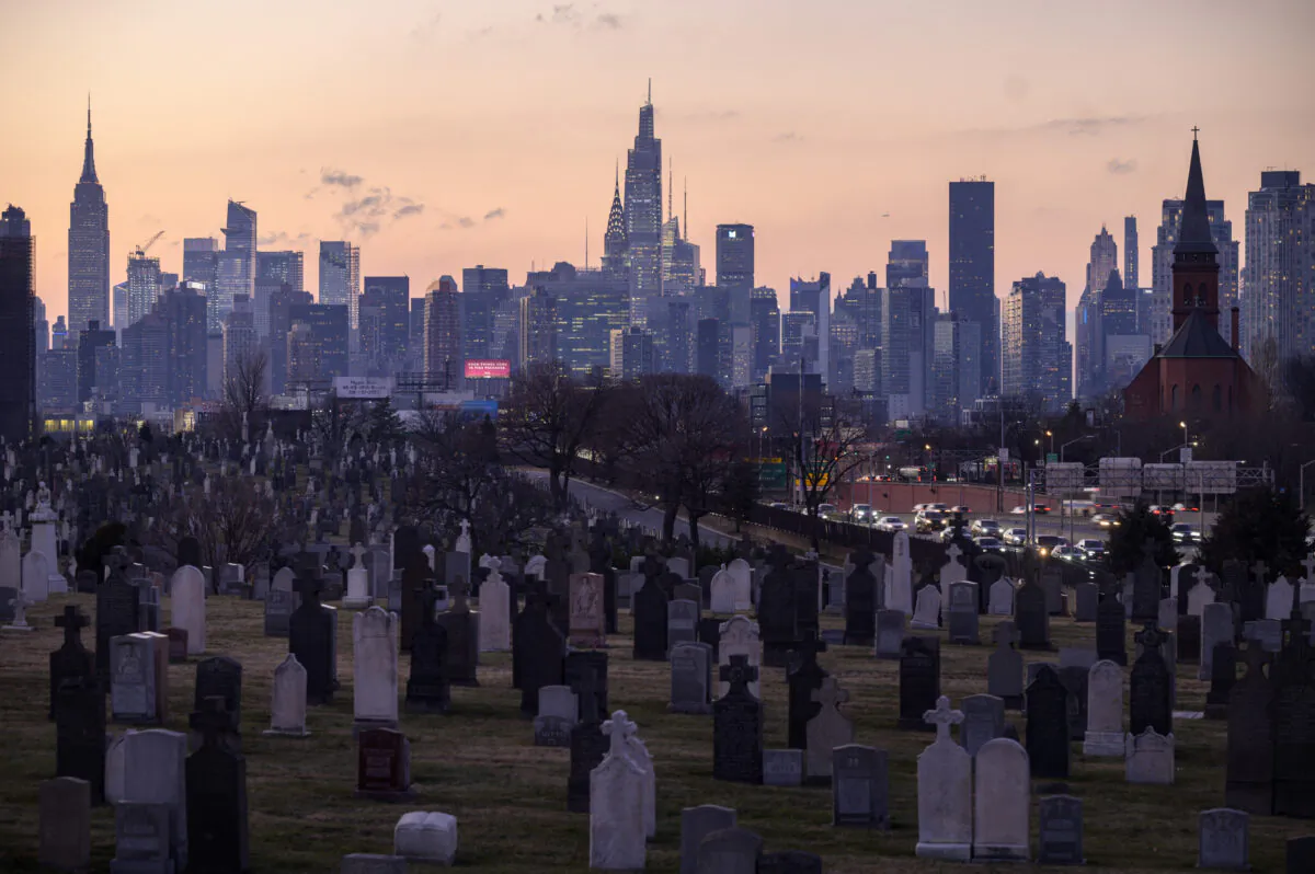 A general view shows landmark buildings of the Manhattan skyline rising behind the Calvary Cemetery in the Queens borough of New York on January 25, 2022. (ED JONES/AFP via Getty Images)