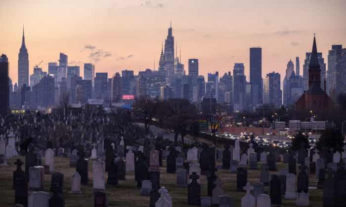 A general view shows landmark buildings of the Manhattan skyline rising behind the Calvary Cemetery in the Queens borough of New York on January 25, 2022. (ED JONES/AFP via Getty Images)