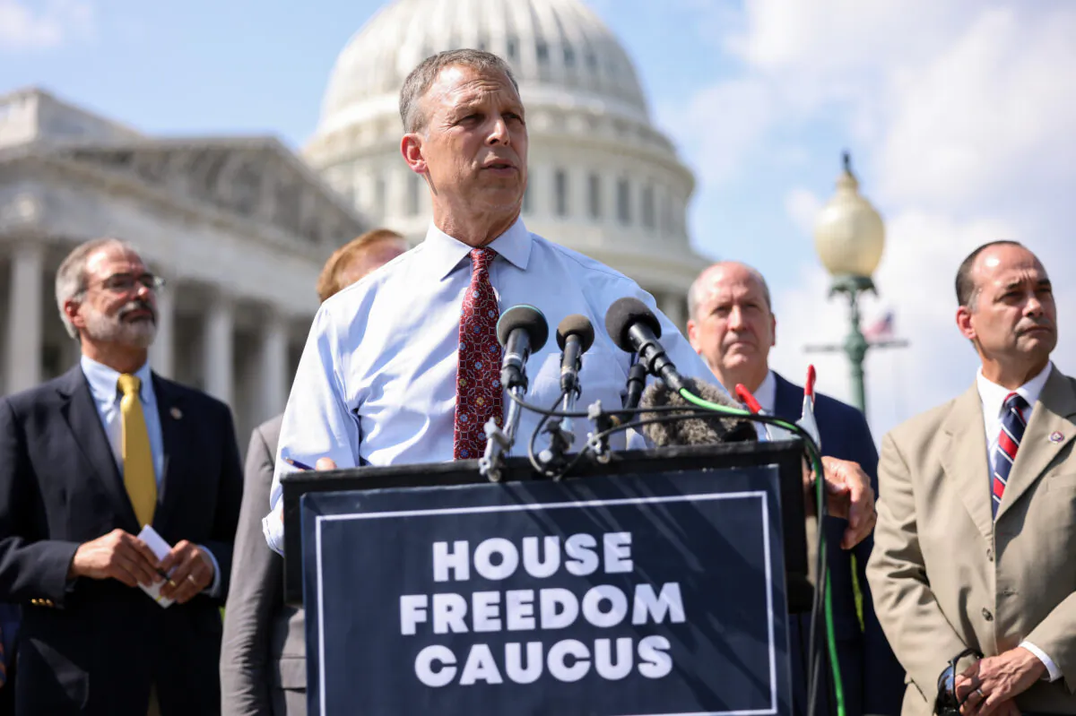 Rep. Scott Perry (R-Pa.), joined by members of the House Freedom Caucus, speaks at a news conference on the infrastructure bill outside the Capitol Building in Washington, on Aug. 23, 2021. (Kevin Dietsch/Getty Images)