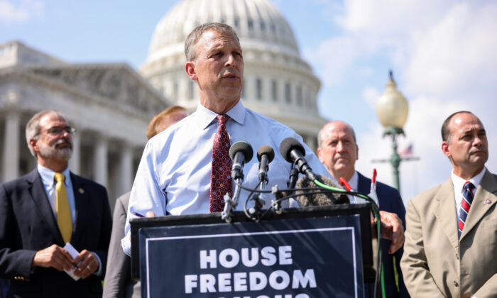 Rep. Scott Perry (R-Pa.), joined by members of the House Freedom Caucus, speaks at a news conference on the infrastructure bill outside the Capitol Building in Washington, on Aug. 23, 2021. (Kevin Dietsch/Getty Images)