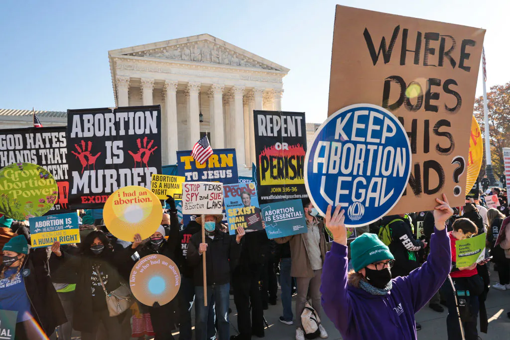 Demonstrators gather in front of the U.S. Supreme Court as the justices 
hear arguments in Dobbs v. Jackson Women's Health, a case about a Mississippi law that bans most abortions after 15 weeks, in Washington, on Dec. 1, 2021. (Chip Somodevilla/Getty Images)