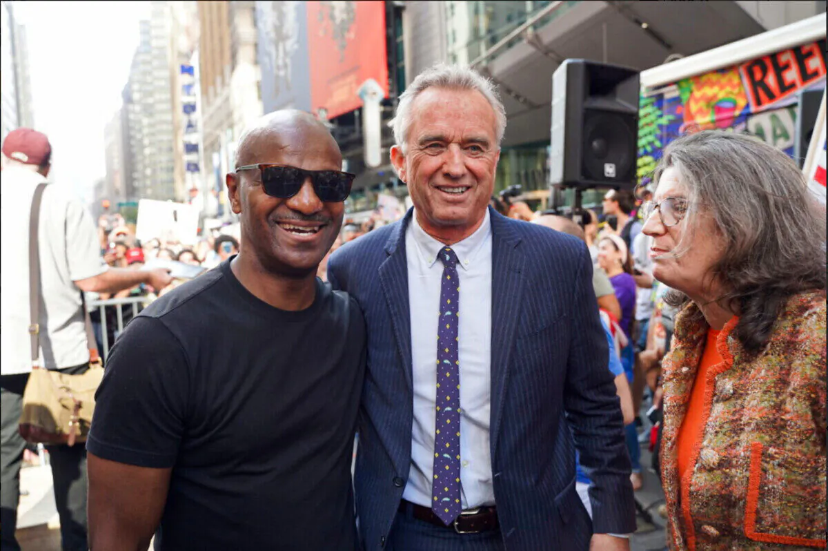 Mary Holland (R) Robert Kennedy Jr. (C) and Kevin Jenkins (L) speak at Broadway Rally For Freedom in Manhattan, New York, on Oct. 16, 2021. (Enrico Trigoso/The Epoch Times)