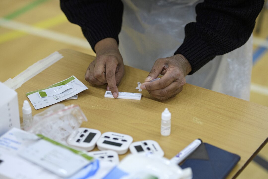 COVID-19 tests in England in a file photograph. (Oli Scarff/AFP via Getty Images)