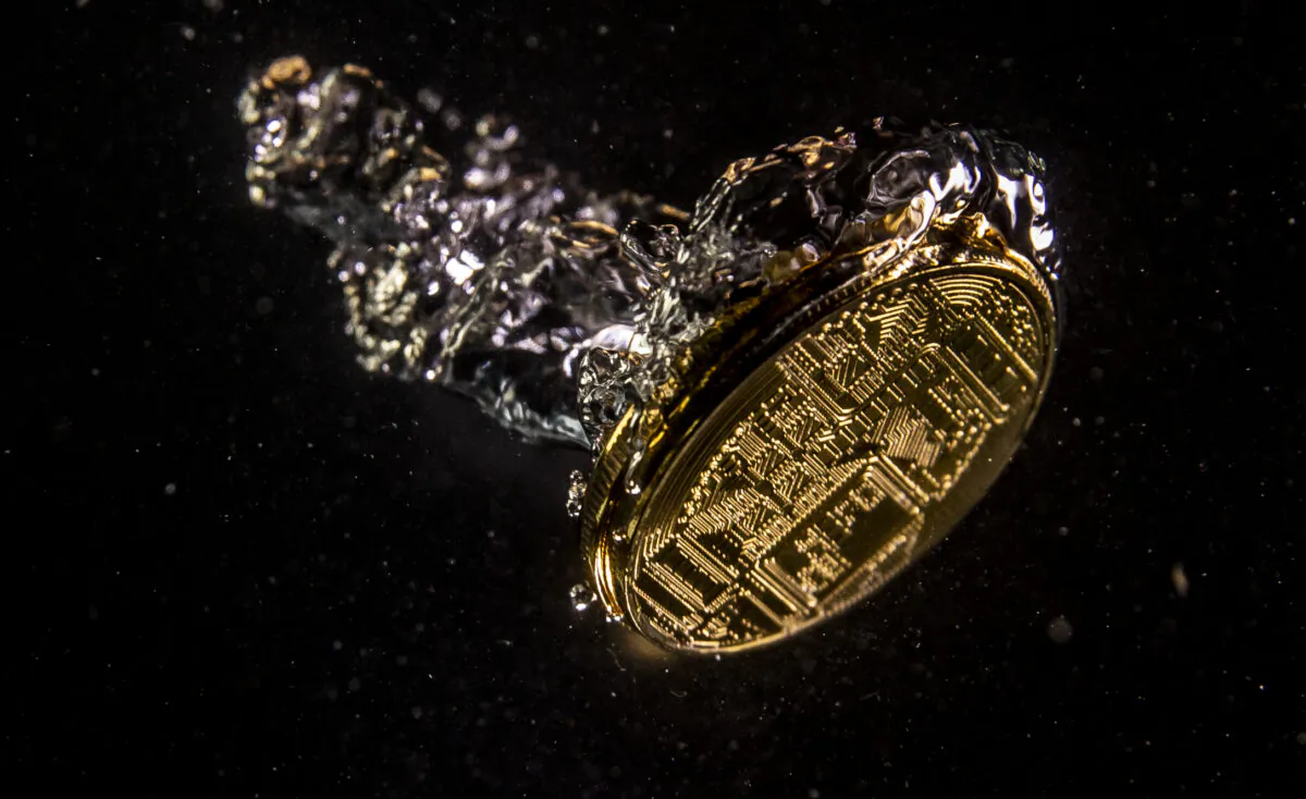 A visual representation of digital currency sinking in water. (Dan Kitwood/Getty Images)