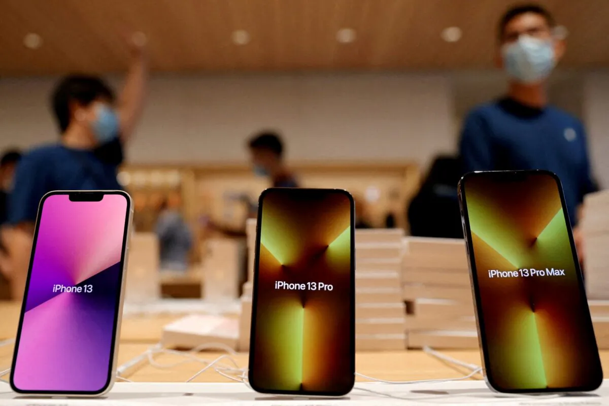 Apple's iPhone 13 models are pictured at an Apple Store in Beijing, on Sept. 24, 2021. (Carlos Garcia Rawlins/Reuters)