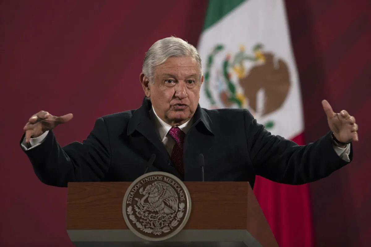 Mexican President Andres Manuel Lopez Obrador gives his daily, morning news conference at the presidential palace, Palacio Nacional, in Mexico City, on Dec. 18, 2020. (Marco Ugarte/AP Photo)