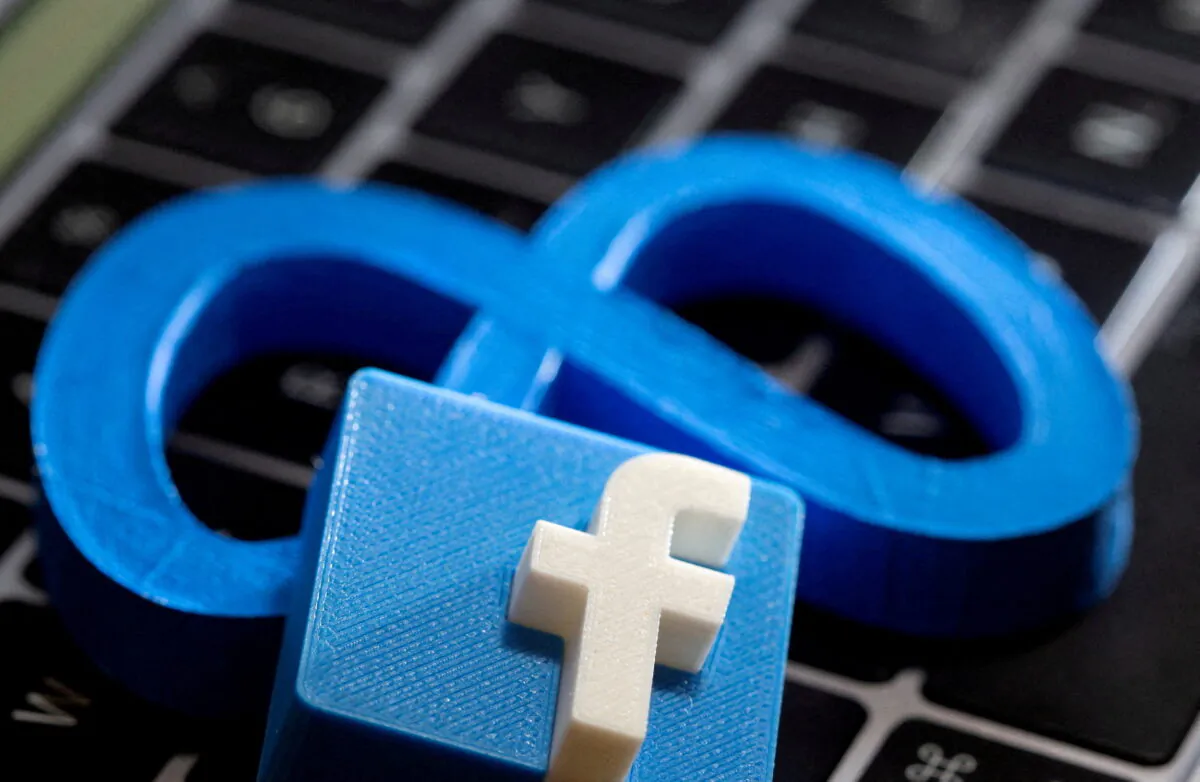 The logo of Facebook parent Meta is beneath a 3D-printed logo of Facebook on a laptop keyboard in this illustration taken on Nov. 2, 2021. (Dado Ruvic/Illustration/Reuters)