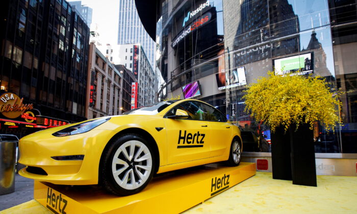 A Hertz Tesla electric vehicle is displayed during the Hertz Corporation IPO at the Nasdaq Market site in Times Square in New York, on Nov. 9, 2021. (Brendan McDermid/Reuters)