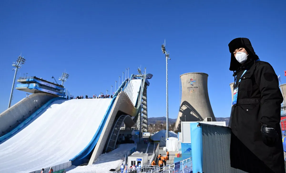 A Chinese security member stands at the Big Air Shougang venue in Beijing on Feb. 3, 2022 ahead of the Beijing 2022 Winter Olympic Games. (Manan Vatsyayana/AFP via Getty Images)
