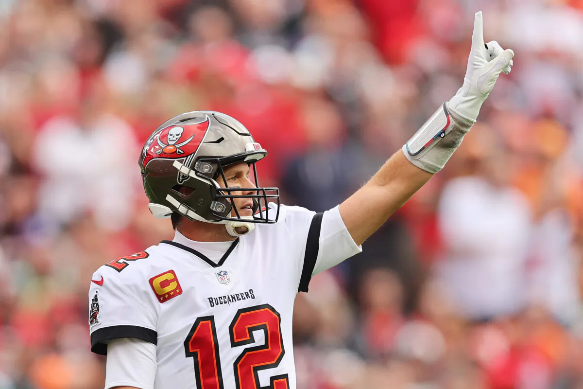 Tom Brady #12 of the Tampa Bay Buccaneers celebrates against the Philadelphia Eagles in the first half of the NFC Wild Card Playoff game at Raymond James Stadium in Tampa, Fla., on Jan. 16, 2022. (Michael Reaves/Getty Images)