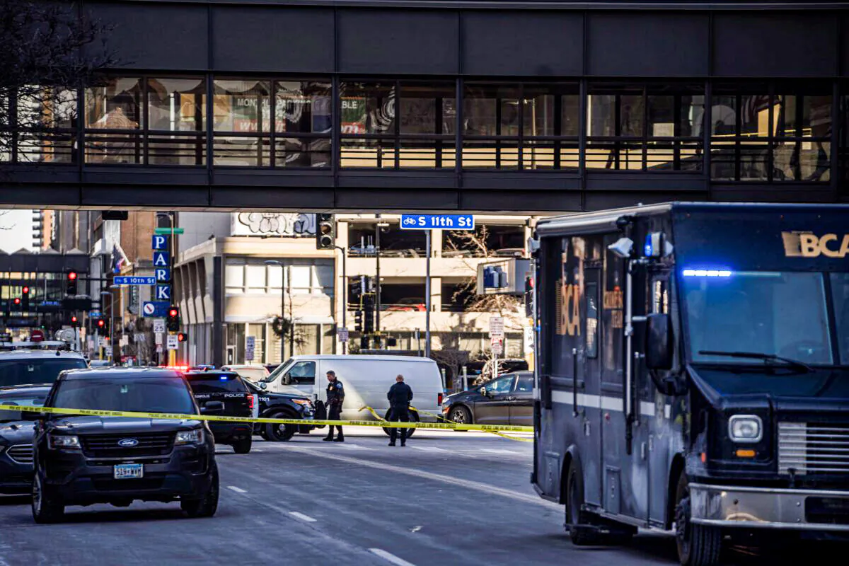 Police investigate a shooting in Minneapolis, Minn., on Feb. 2, 2022. (Richard Tsong-Taatarii/Star Tribune via AP)