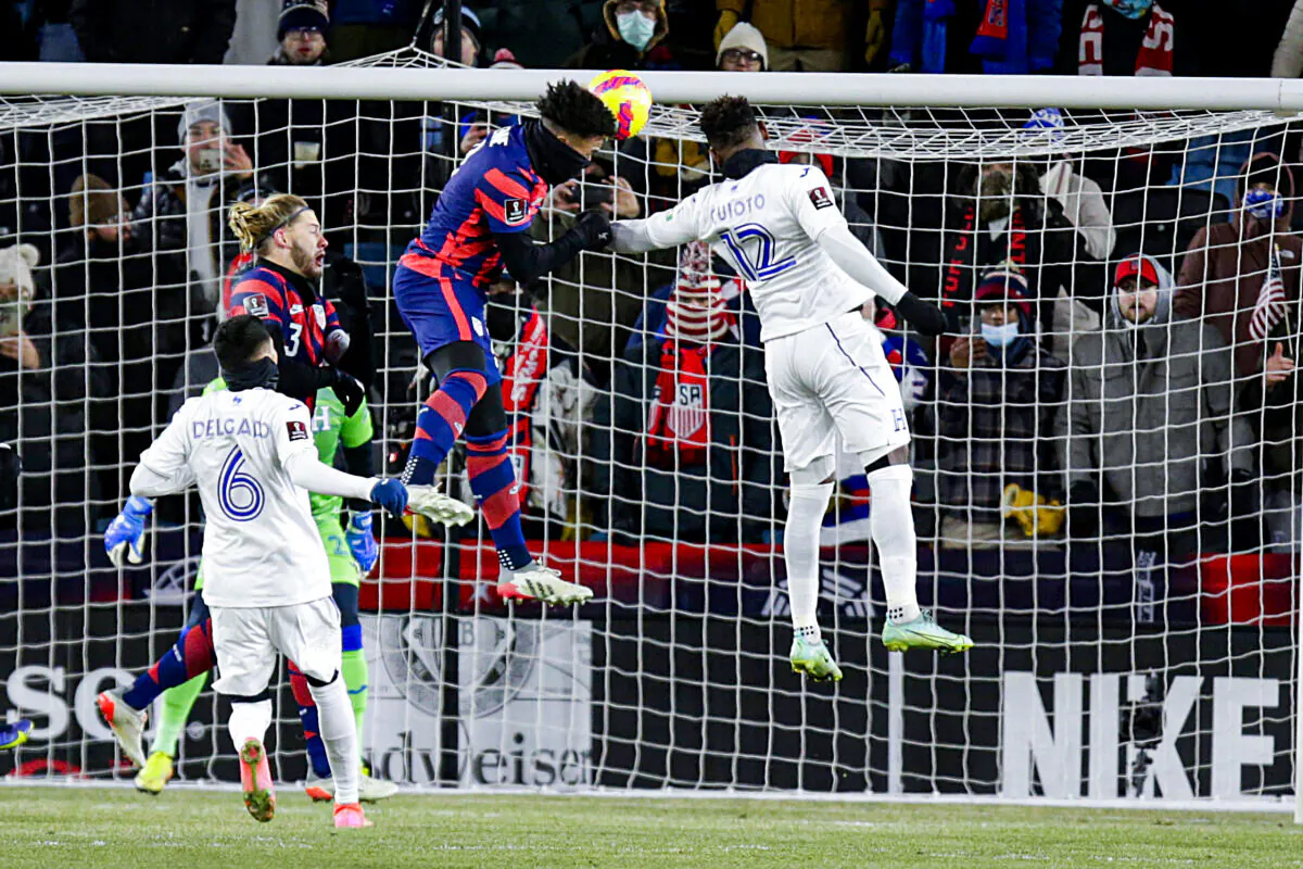 United States' Weston McKennie (8) heads in a goal past Honduras' Rommel Quioto (12) and Juan Delgado (6) with United States' Walker Zimmerman (3) and Honduras goalkeeper Luis Lopez (22) looking on during the first half of a FIFA World Cup qualifying soccer match, in St. Paul, Minn., Feb. 2, 202. (Andy Clayton-King/AP Photo)