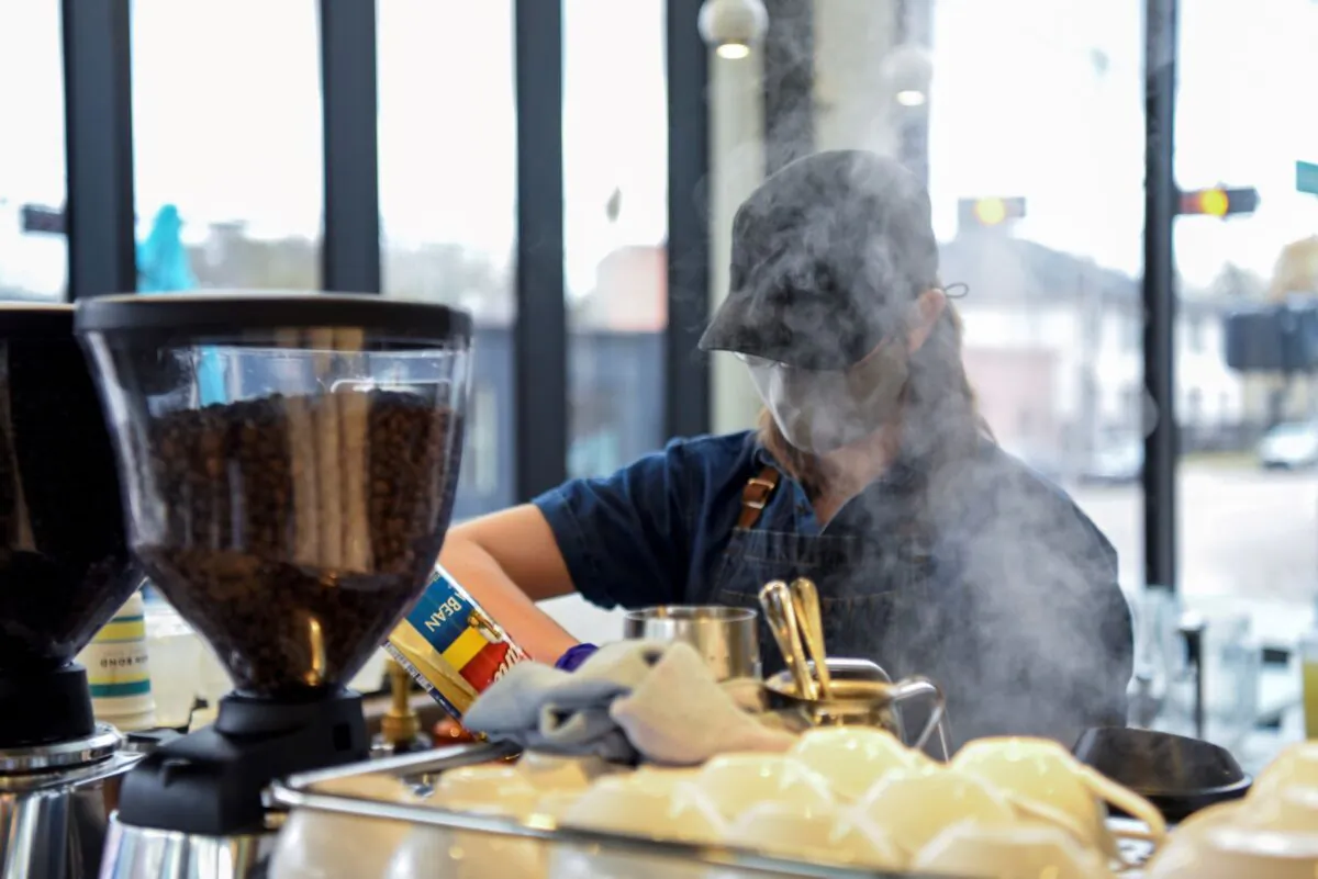 A barista makes coffee for a customer in Houston, Texas, on March 10, 2021. (Callaghan O'Hare/Reuters)