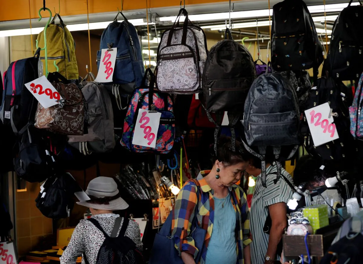 Shoppers look around goods at a shop in Tokyo, Japan, on Oct. 1, 2019. (Kim Kyung-Hoon/Reuters)