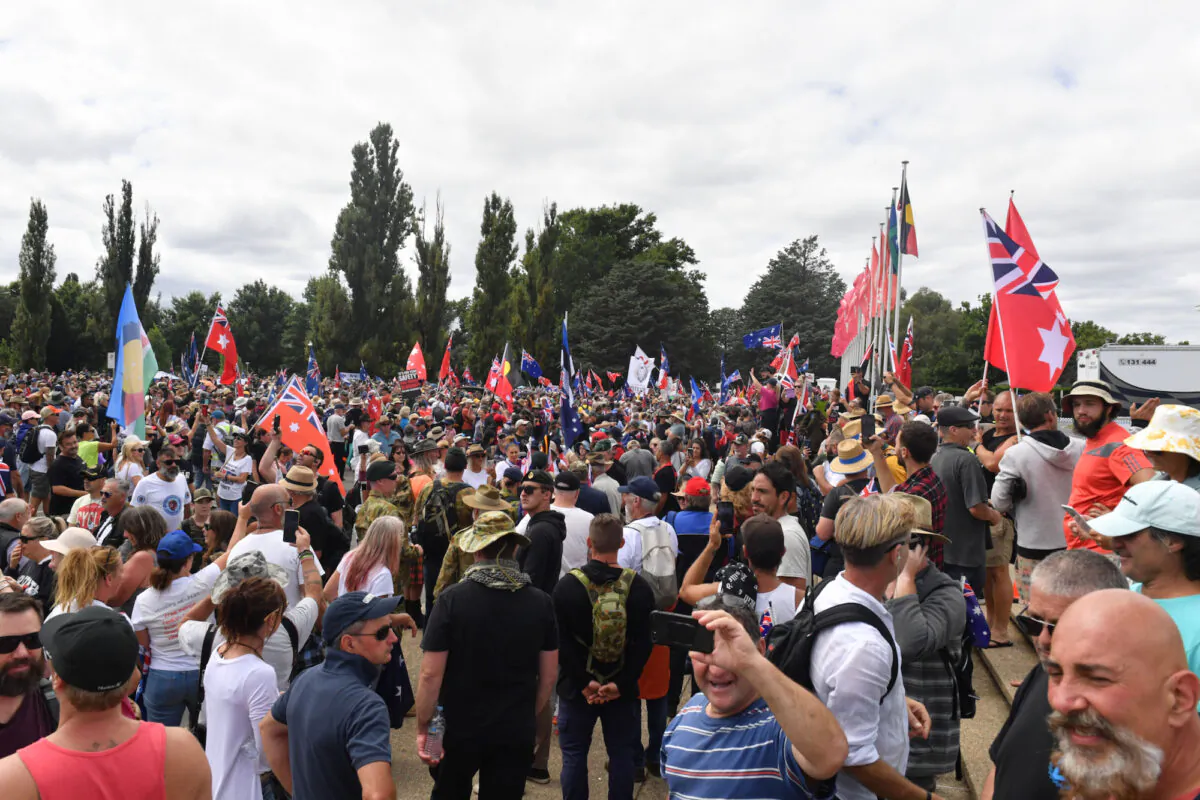 Protesters with flags are seen during an anti-vaccination rally outside Old Parliament House in Canberra, Australia, on Feb. 5, 2022. (AAP Image/Mick Tsikas)