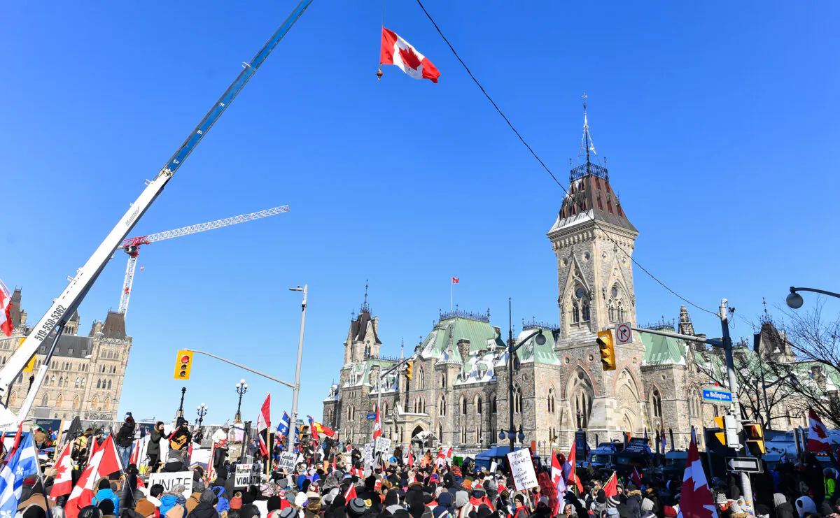 Thousands gather around Parliament Hill in support of the Freedom Convoy protest in Ottawa on Feb. 5, 2022. (Minas Panagiotakis/Getty Images)