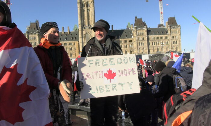 Protesters gather on Parliament Hill in Ottawa to demonstrate against COVID-19 mandates and restrictions on Feb. 5, 2022. (Annie Wu/NTD)