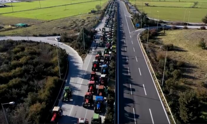 Hundreds of tractors parked in rows on part of national highway, near Larissa, Greece, on Feb. 4, 2022. (Reuters/Screenshot via The Epoch Times)