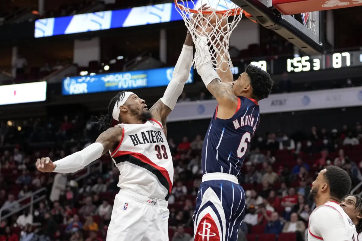 Portland Trail Blazers forward Robert Covington (33) blocks a shot by Houston Rockets forward Kenyon Martin Jr. (6) during the second half of an NBA basketball game, in Houston, on Jan. 28, 2022. (Eric Christian Smith/AP Photo)