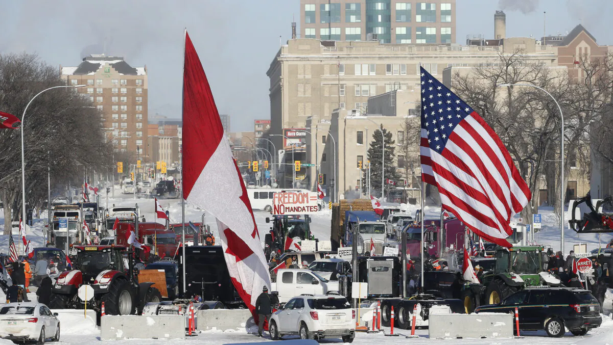 People rally against provincial and federal COVID-19 vaccine mandates and in support of Ottawa protesters, outside the Manitoba Legislature in Winnipeg on Feb. 4, 2022. (The Canadian Press/John Woods)