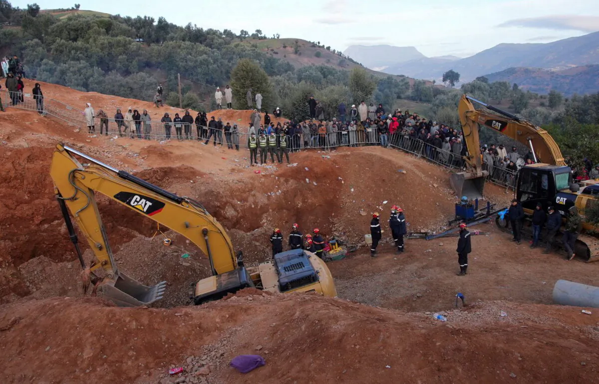 Rescuers work to reach a five-year-old boy trapped in a well in the northern hill town of Chefchaouen, Morocco, on Feb. 5, 2022. (Thami Nouas/Reuters)