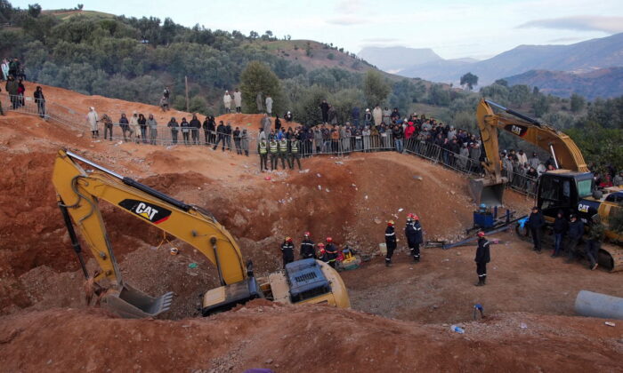 Rescuers work to reach a five-year-old boy trapped in a well in the northern hill town of Chefchaouen, Morocco, on Feb. 5, 2022. (Thami Nouas/Reuters)