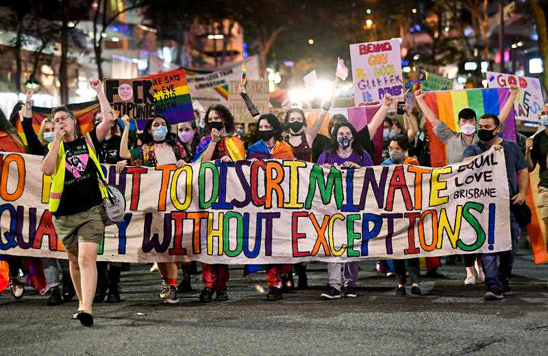 Supporters and members of the LGBTQI+ community are seen protesting against Citipointe Christian College during a protest march through the CBD in Brisbane, Australia, on Feb. 4, 2022. (AAP Image/Darren England)
