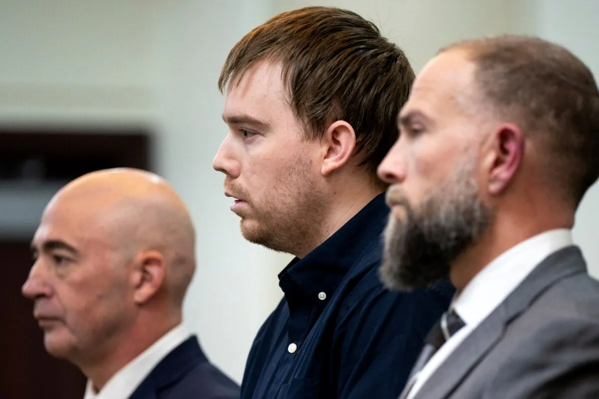 Travis Reinking (C), reacts as the verdict is read during day five of Reinking's murder trial at the Justice A.A. Birch Building in Nashville, Tenn., on Feb. 4, 2022. (Andrew Nelles/The Tennessean via AP)