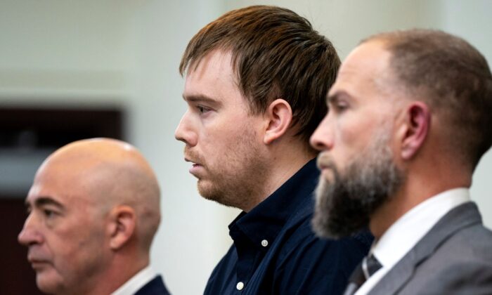Travis Reinking (C), reacts as the verdict is read during day five of Reinking's murder trial at the Justice A.A. Birch Building in Nashville, Tenn., on Feb. 4, 2022. (Andrew Nelles/The Tennessean via AP)