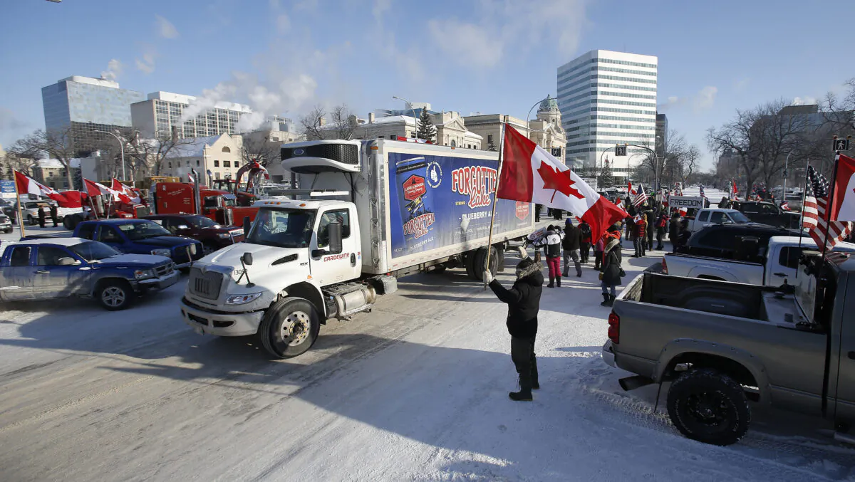 People rally against provincial and federal COVID-19 mandates and restrictions outside the Manitoba Legislature in Winnipeg on Feb. 4, 2022. (The Canadian Press/John Woods)