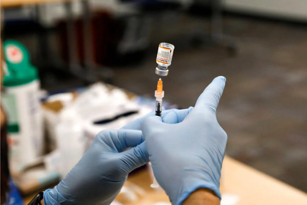 A nurse prepares the Pfizer-BioNTech COVID-19 vaccine in a file image. (Jeff Kowalsky/AFP via Getty Images)