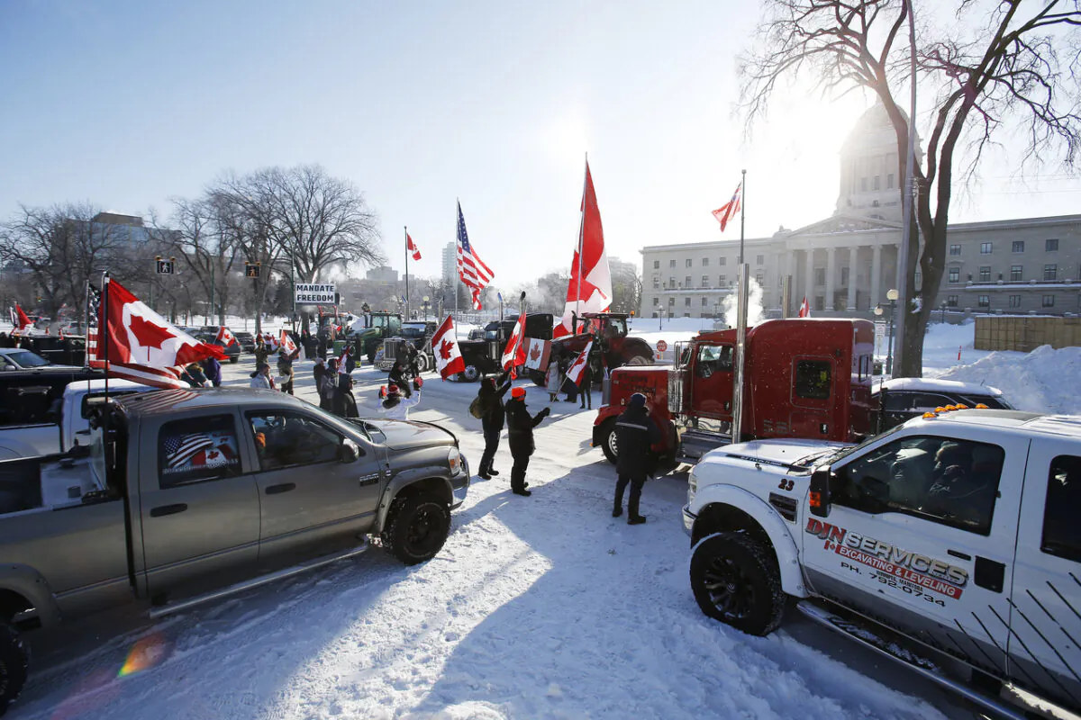 People rally against provincial and federal COVID-19 vaccine mandates and in support of Ottawa protesters, outside the Manitoba Legislature in Winnipeg on Feb. 4, 2022. (The Canadian Press/John Woods)
