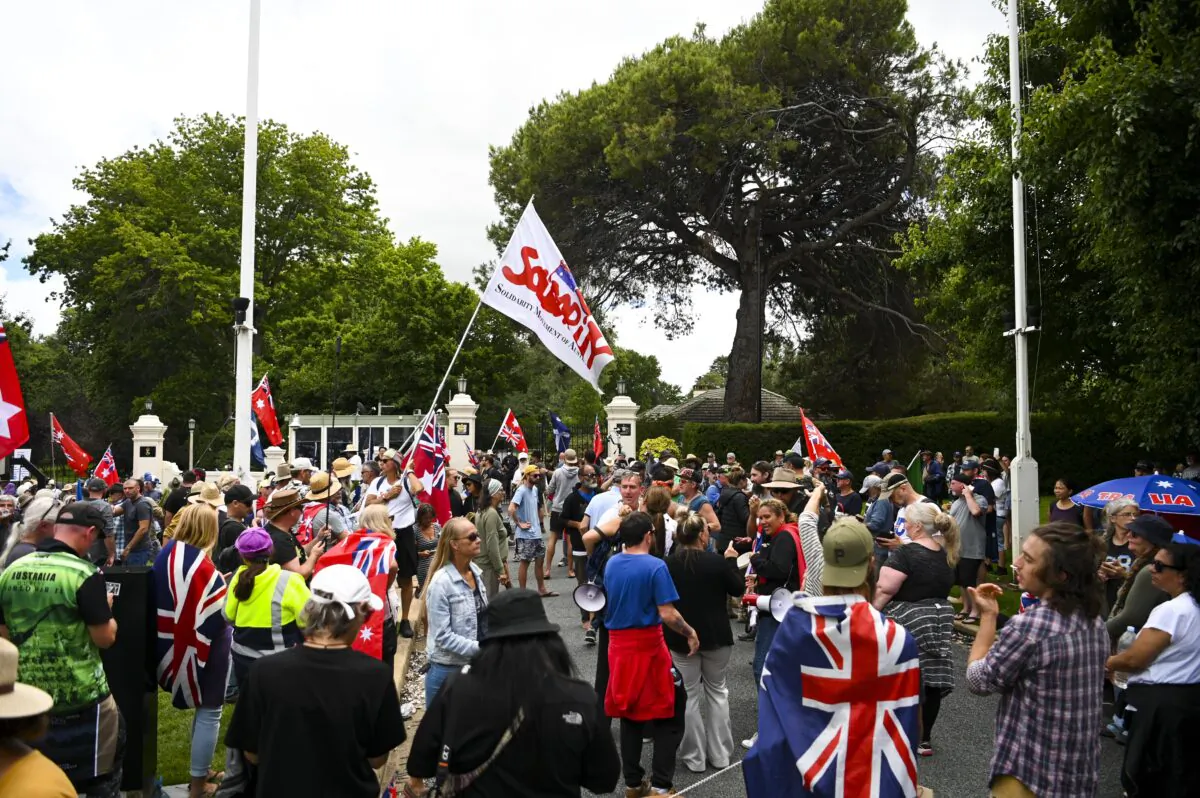 People participate in the "Convoy to Canberra" protests outside Government House in Canberra, Australia, on Feb. 7, 2022. Protesters have surrounded the official residence of the governor-general in Canberra, calling for him to sack the Prime Minister. (AAP Image/Lukas Coch) 
