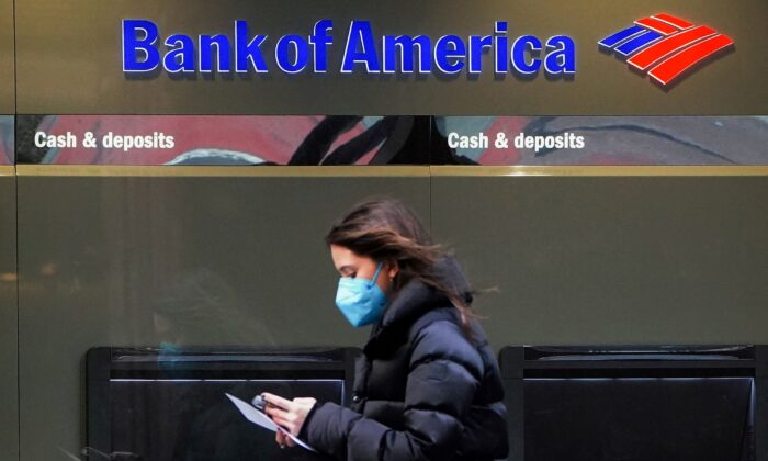A person walks past a Bank of America sign in the Manhattan borough of New York City, on January 19, 2022. (Carlo Allegri/Reuters)