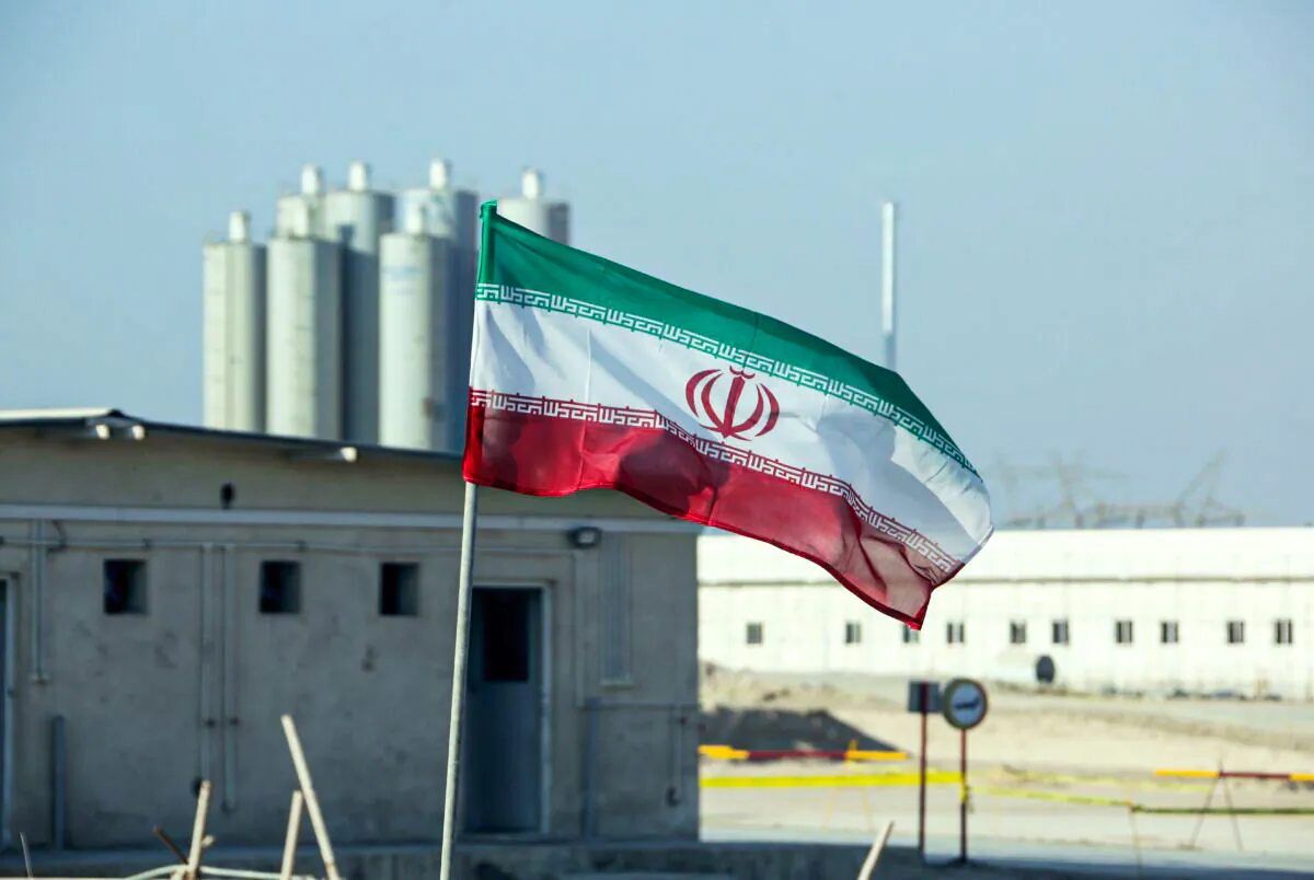 An Iranian flag in Iran's Bushehr nuclear power plant during an official ceremony to kick-start works on a second reactor at the facility, in Bushehr, Iran, on Nov. 10, 2019. (Atta Kenare/AFP via Getty Images)