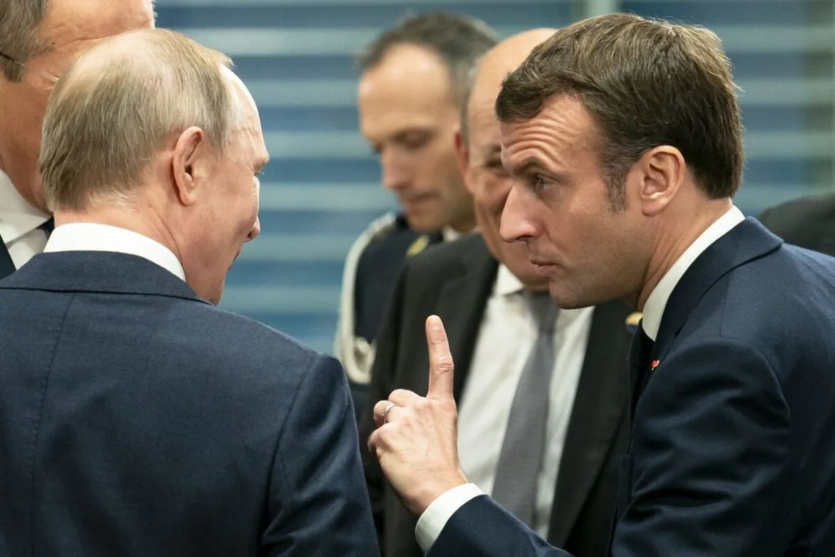 French President Emmanuel Macron (R) speaks with Russian President Vladimir Putin (L) before a meeting at the Chancellery on January 19, 2020 in Berlin, Germany.   (Photo by Emmanuele Contini/Getty Images)