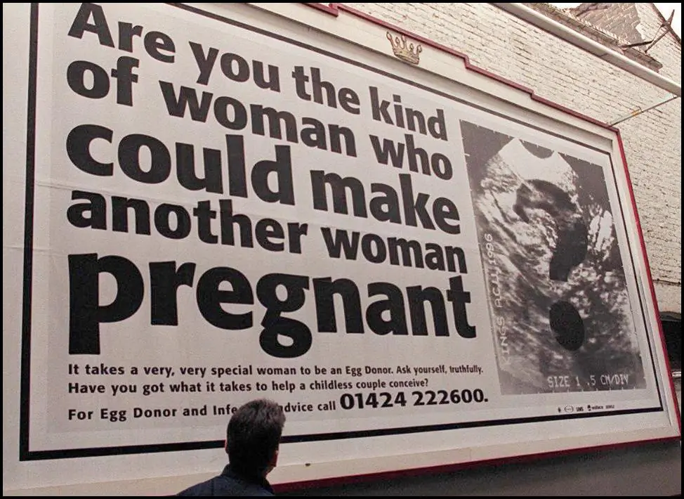 A billboard in a campaign urging women to donate their eggs to childless couples trying for a family in London on Nov. 15, 1996. (Johnny Eggitt/AFP via Getty Images)