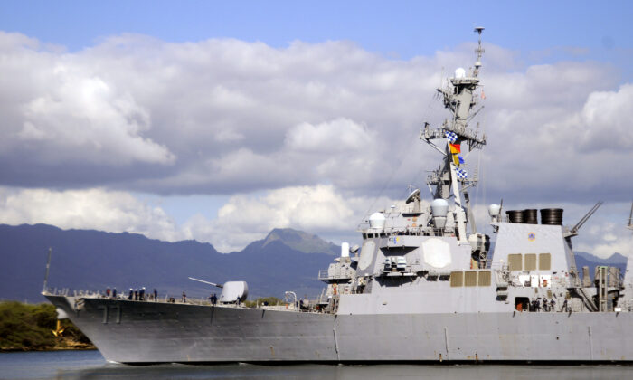 The guided-missile destroyer USS O'Kane makes its way out of Pearl Harbor, Hawaii, on Feb. 27, 2010. (MC2 Mark Logico/U.S. Navy via Getty Images)